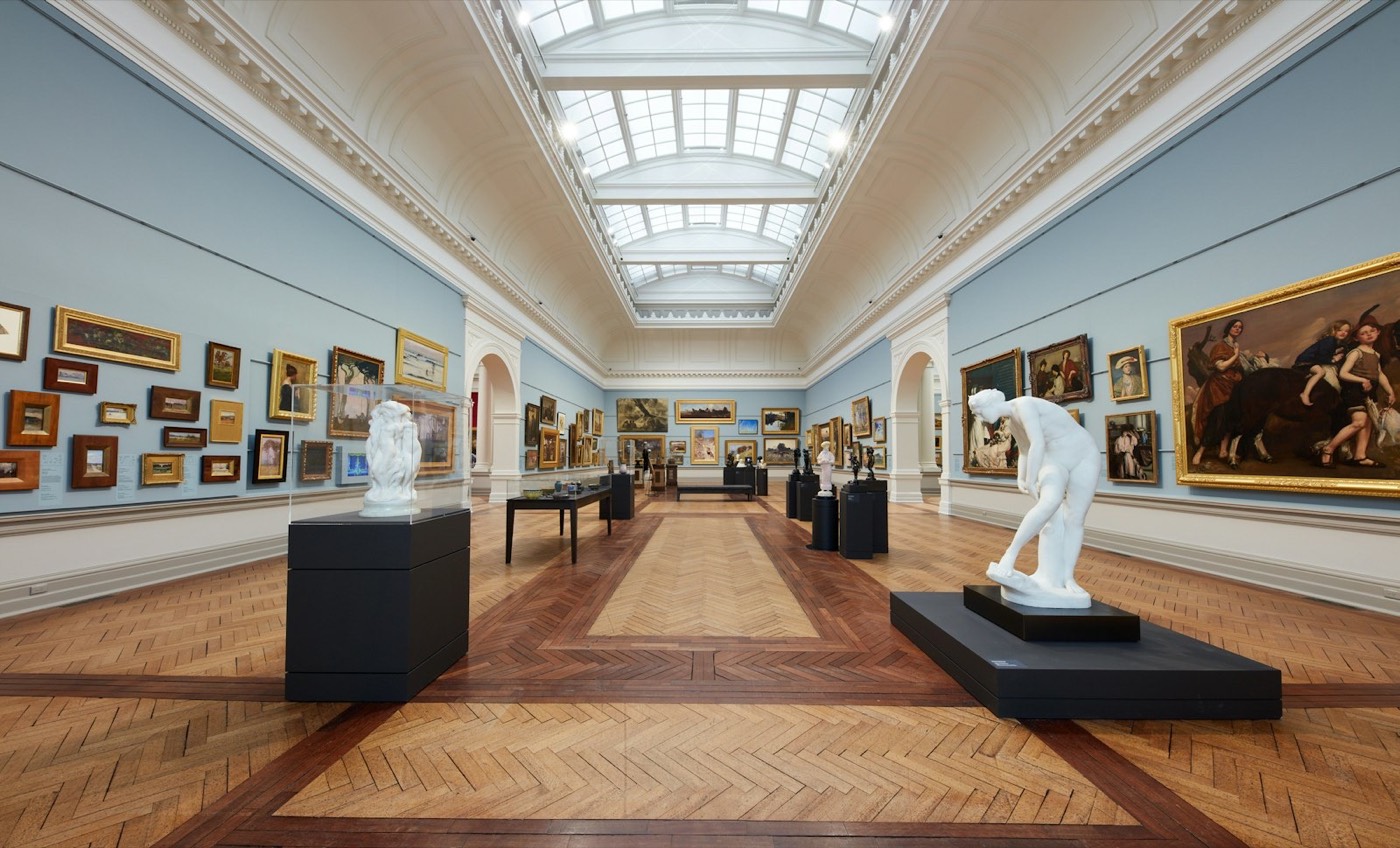 Skylit Grand Courts gallery with paintings and sculptures at the Art Gallery of NSW