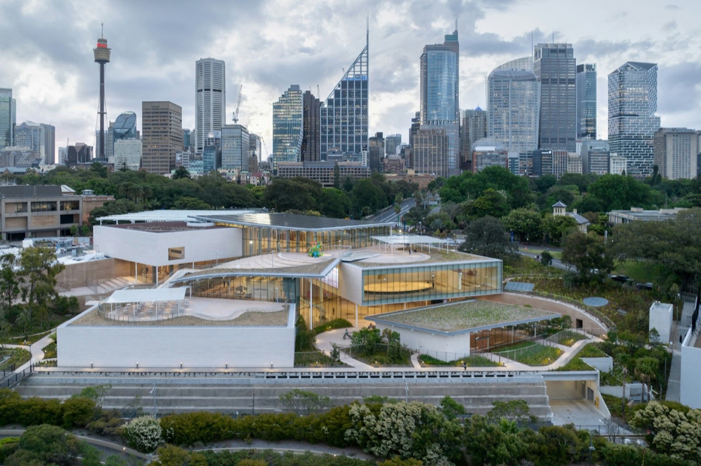 The Art Gallery of NSW's Sydney Modern building in the Domain with the CBD skyline behind