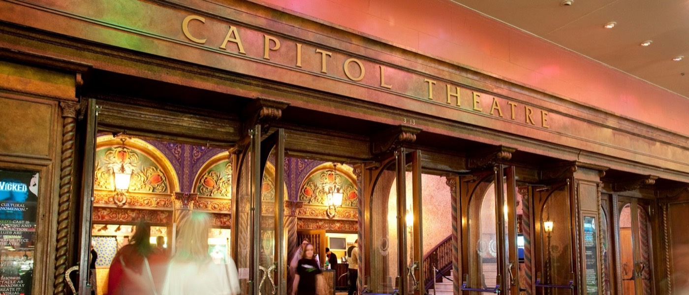 Ornate illuminated entrance of the Capitol Theatre in Haymarket