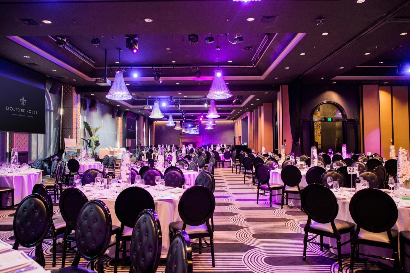 Doltone House Hyde Park Ballroom set for a banquet under purple lighting