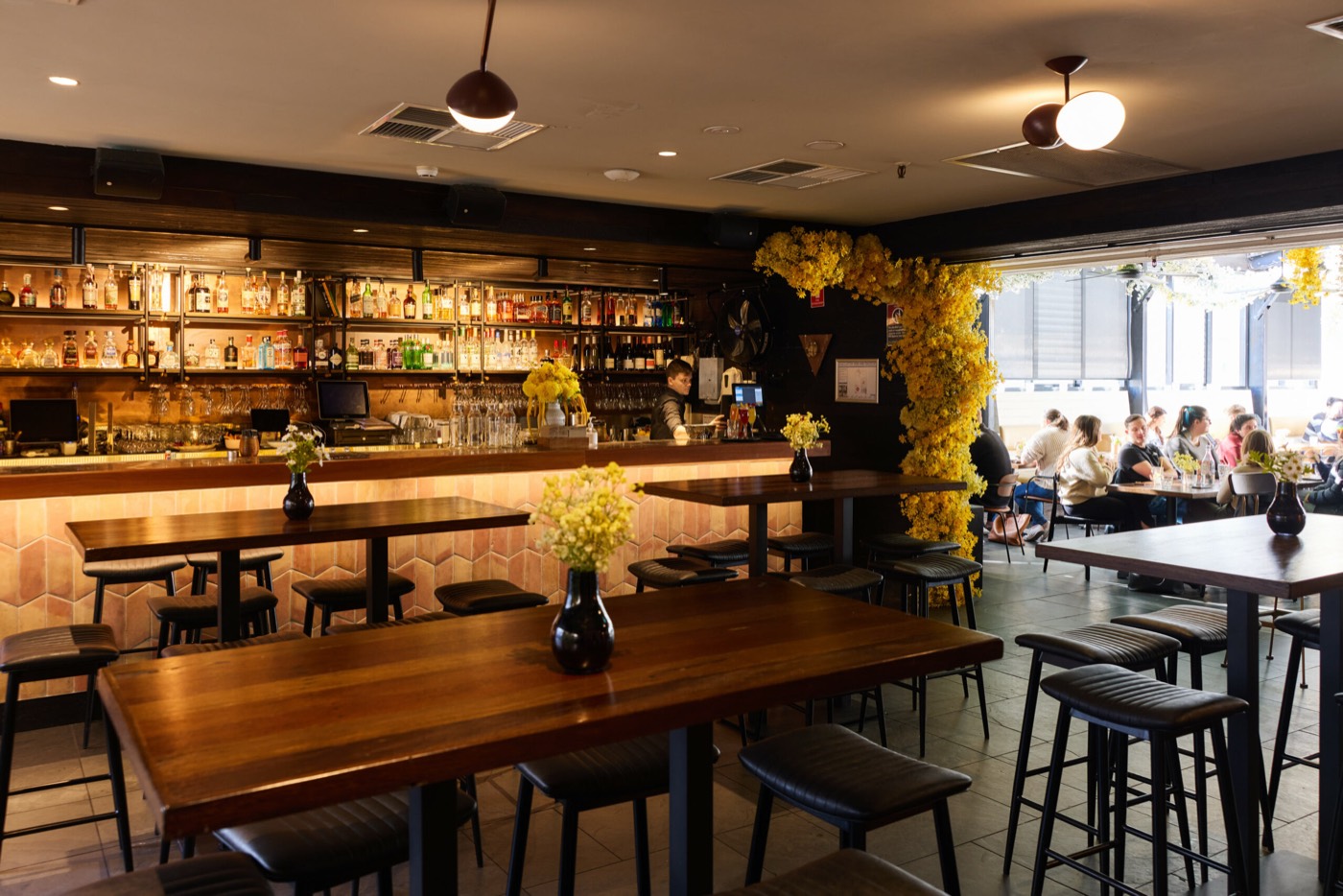 The Rook's rooftop bar with high tables and an open-air terrace