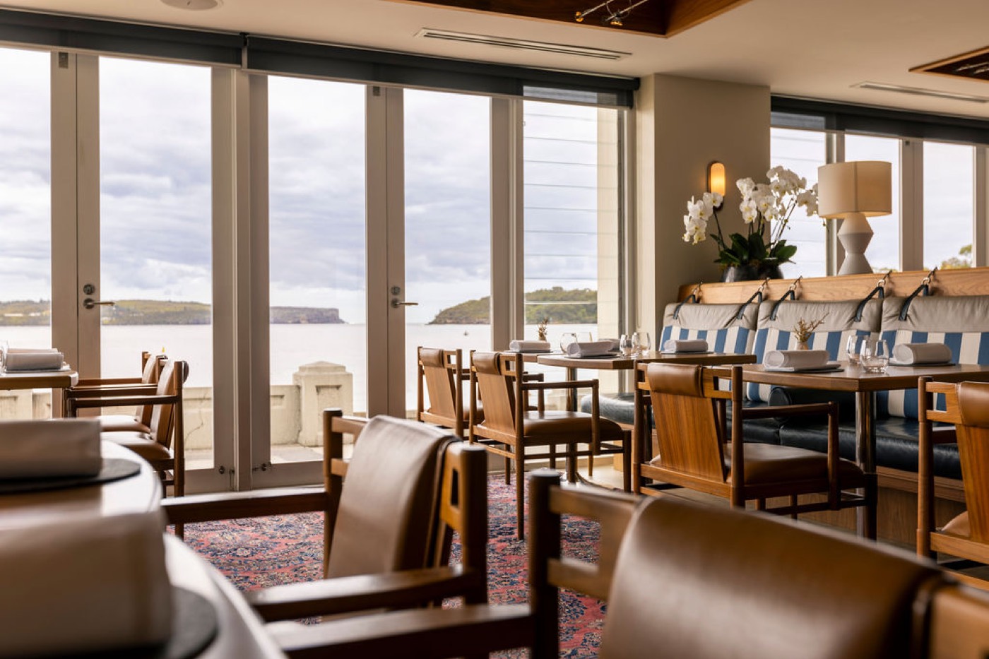 Bathers' Pavilion dining room with tall windows facing Balmoral Beach