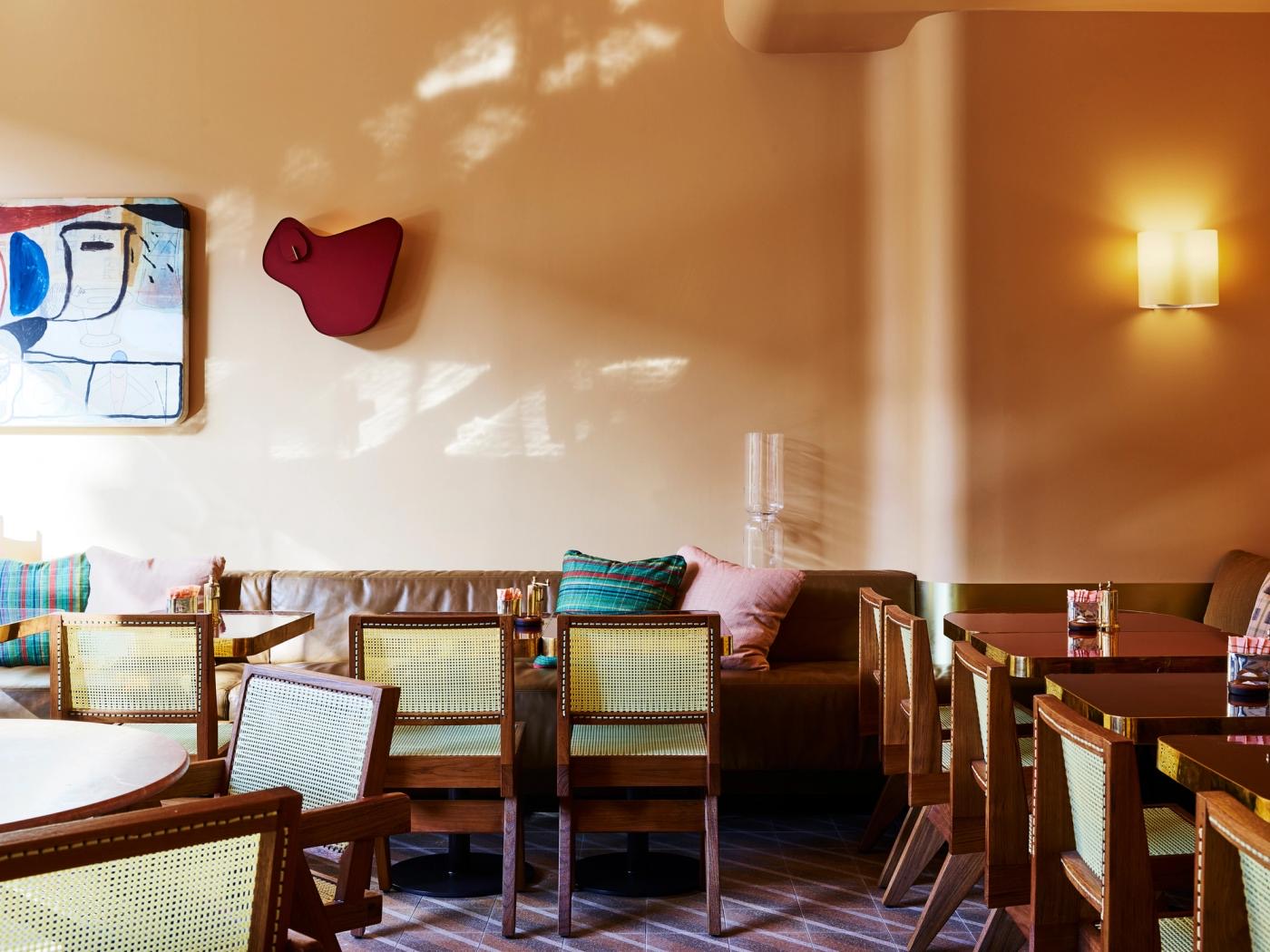 Sunlit dining room with banquettes and cane chairs at bills Surry Hills