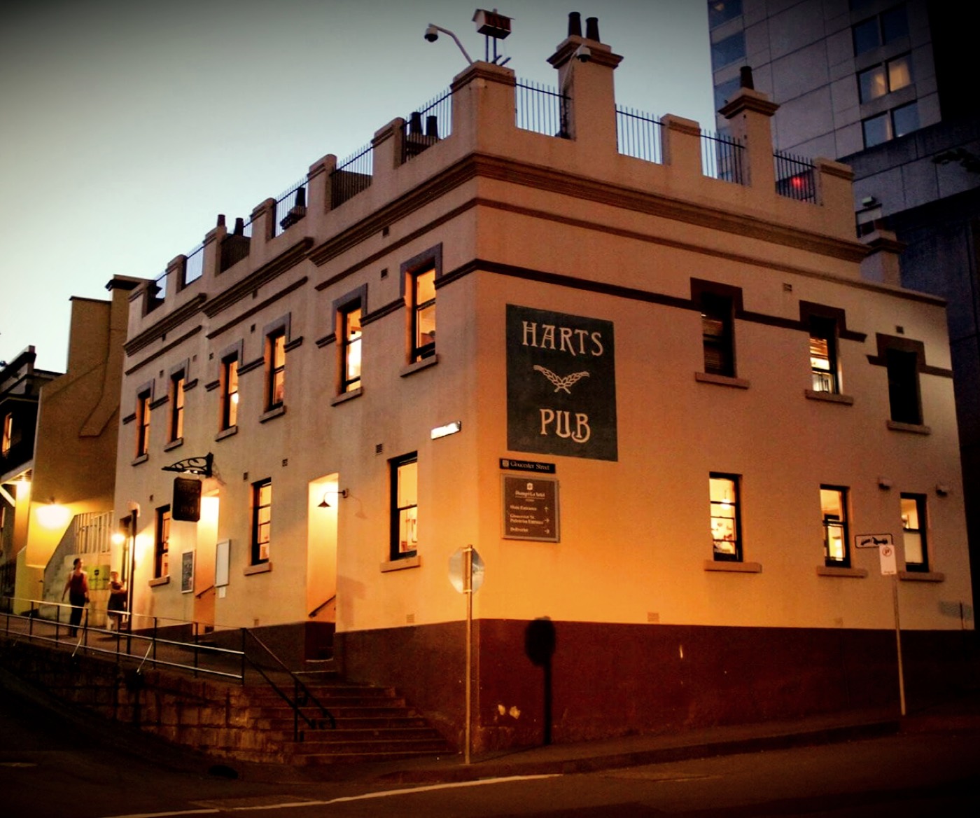 Harts Pub's sandstone heritage building at dusk