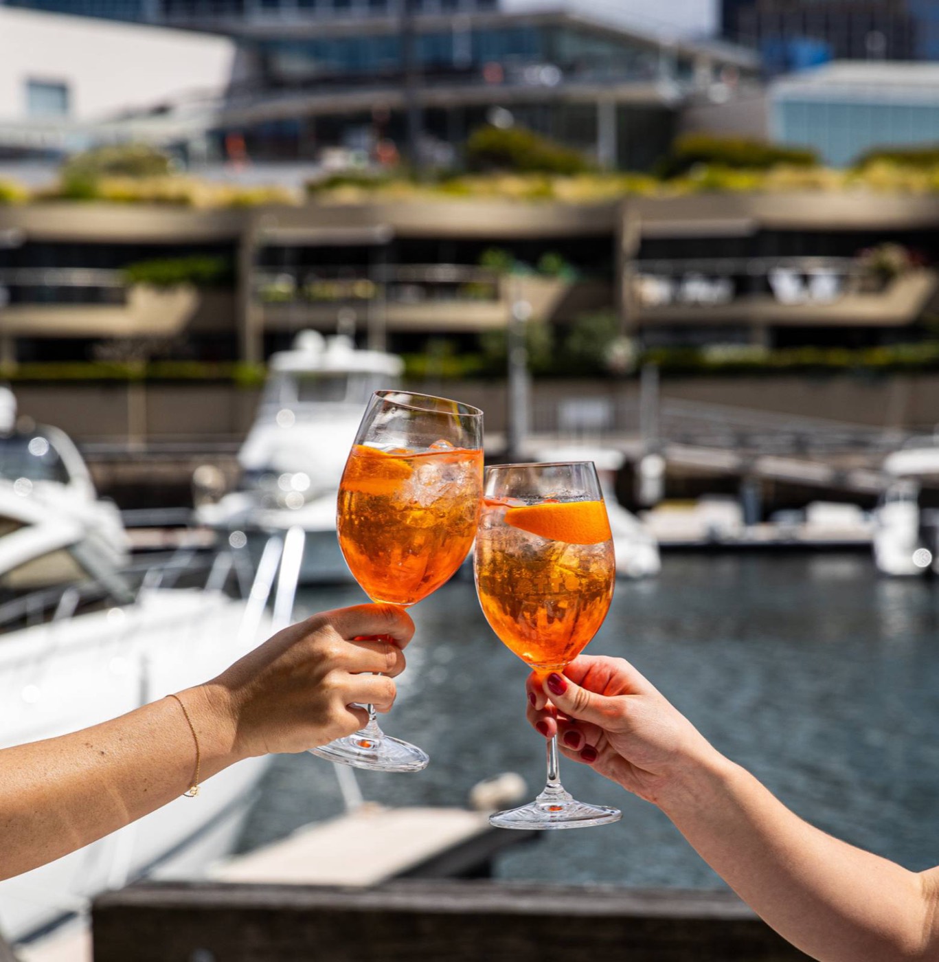 Two spritzes raised beside the marina at Otto on the Woolloomooloo wharf