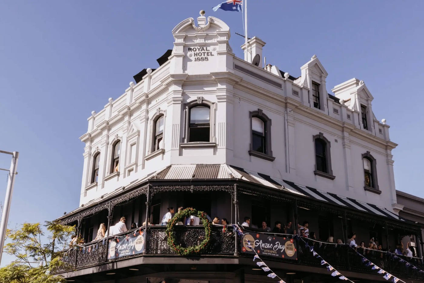 The white Victorian facade and wrought-iron balcony of The Royal Hotel Paddington