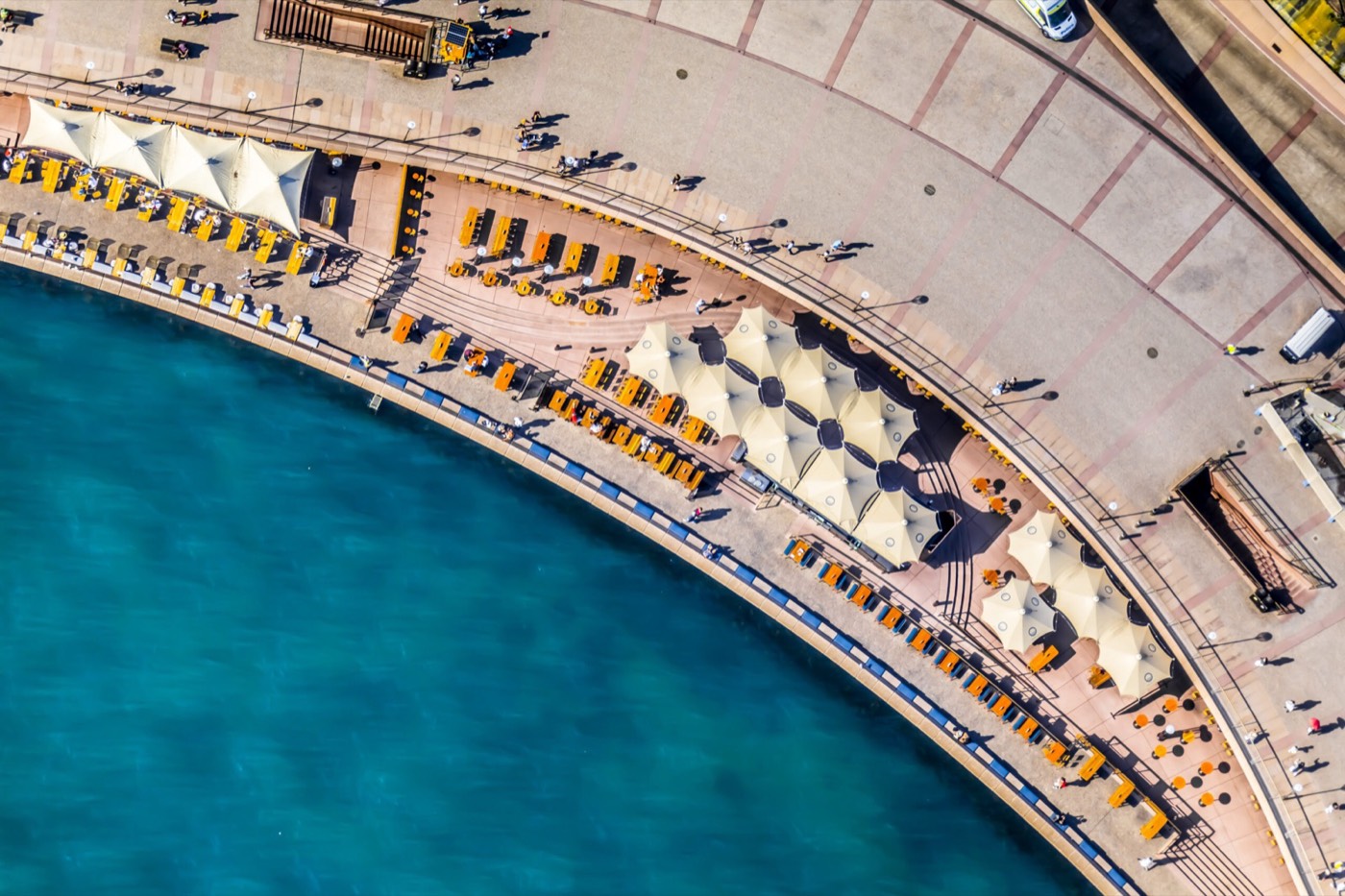 Aerial view of Opera Bar's umbrellas along the harbour promenade
