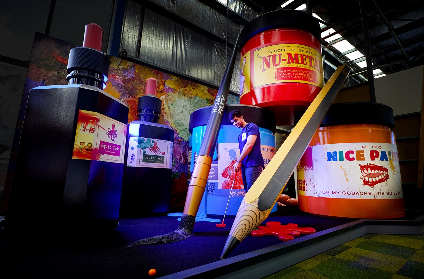 Giant paint-pot themed mini golf hole at Holey Moley