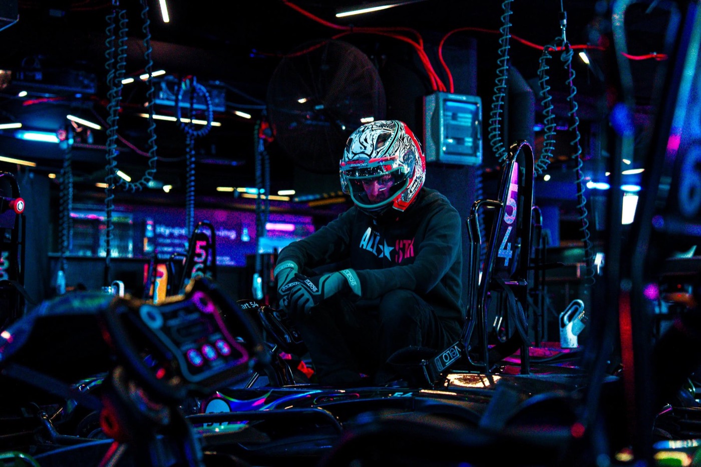 Driver in a helmet sitting in a kart at Hyper Karting, Moore Park