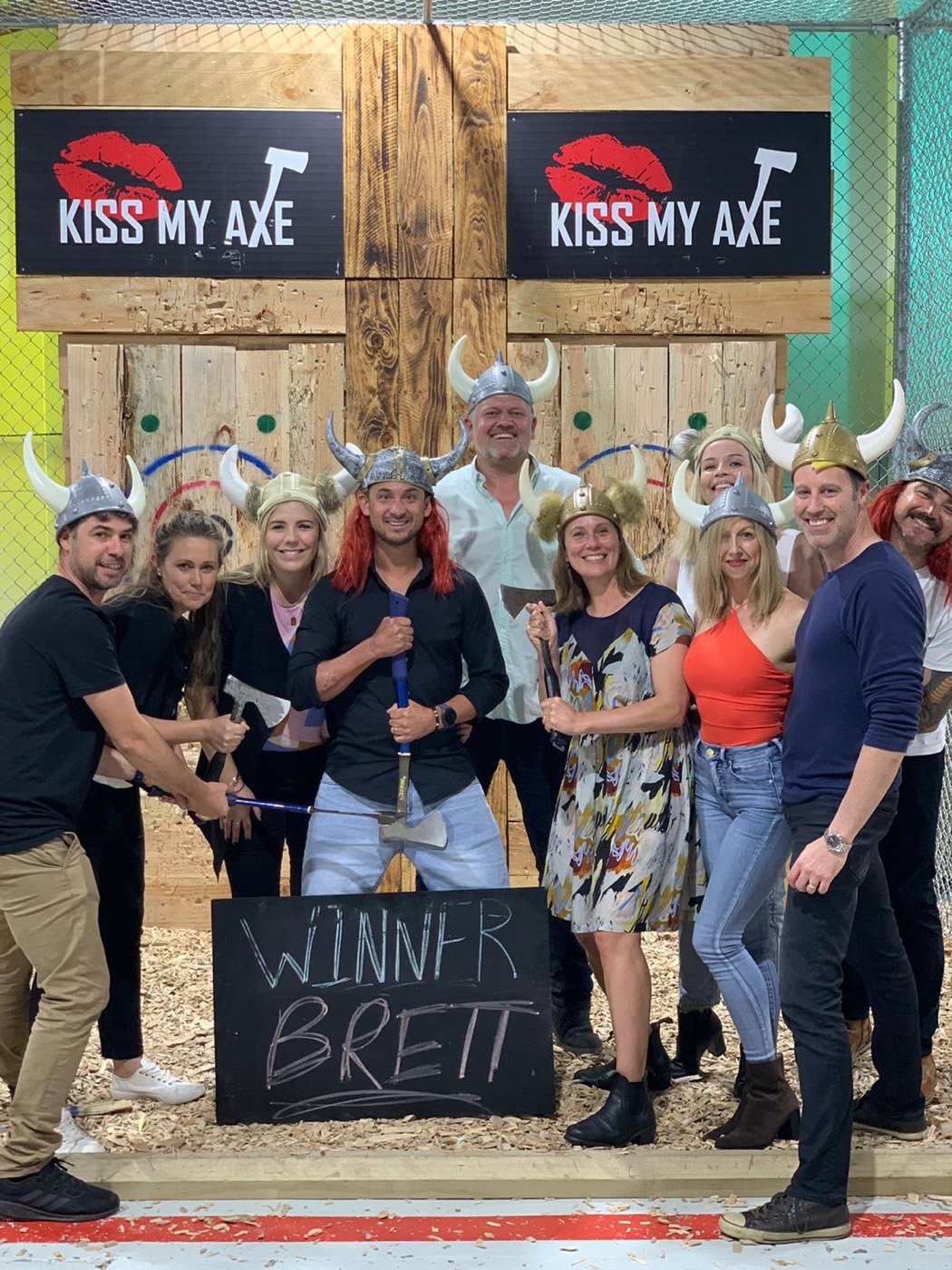 Birthday group in Viking helmets celebrating at Kiss My Axe