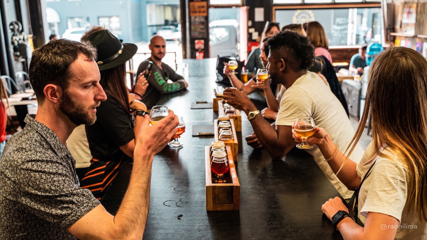 Bucks group tasting beer paddles at a Marrickville brewery
