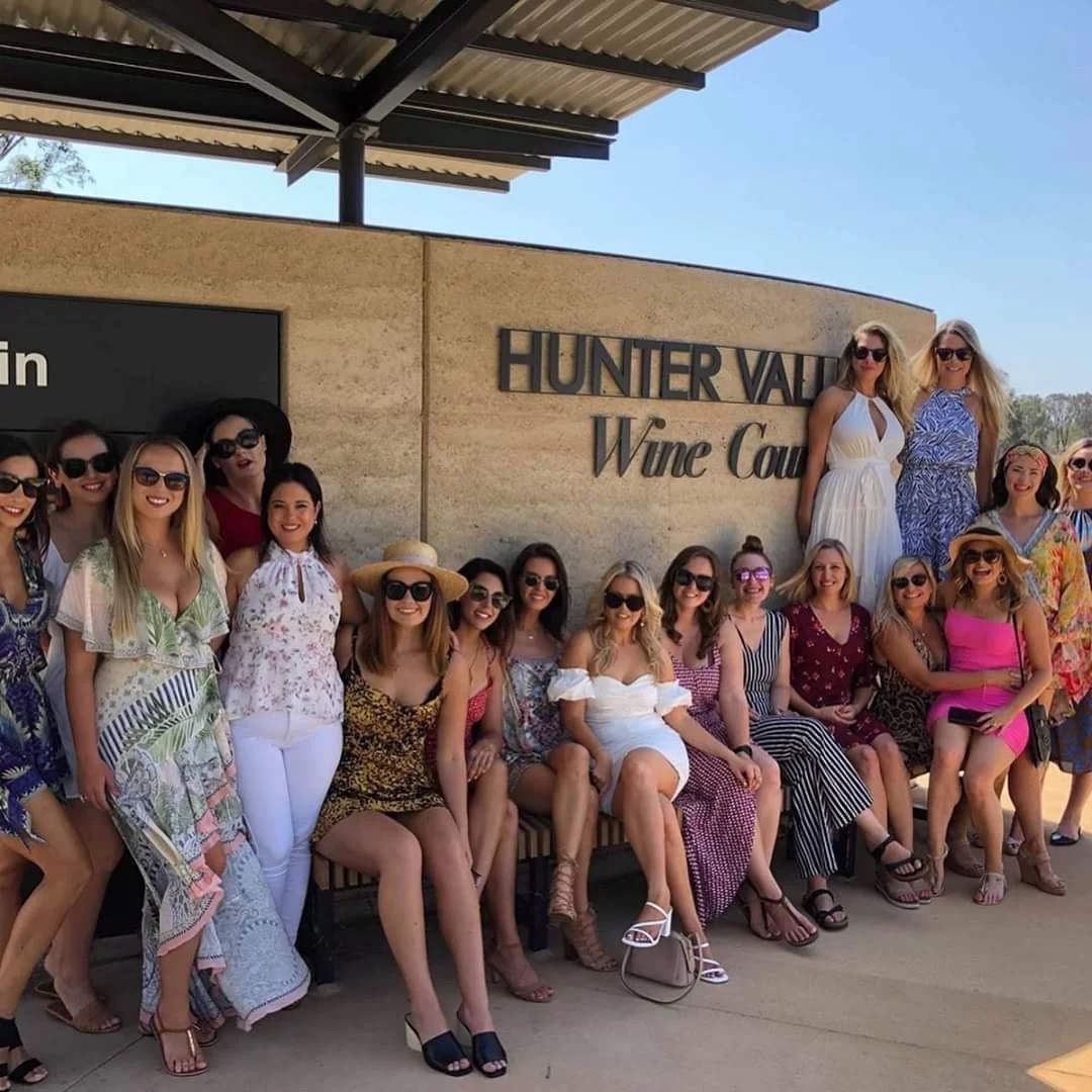 Hens group posing outside a Hunter Valley winery on an Urban Legends tour