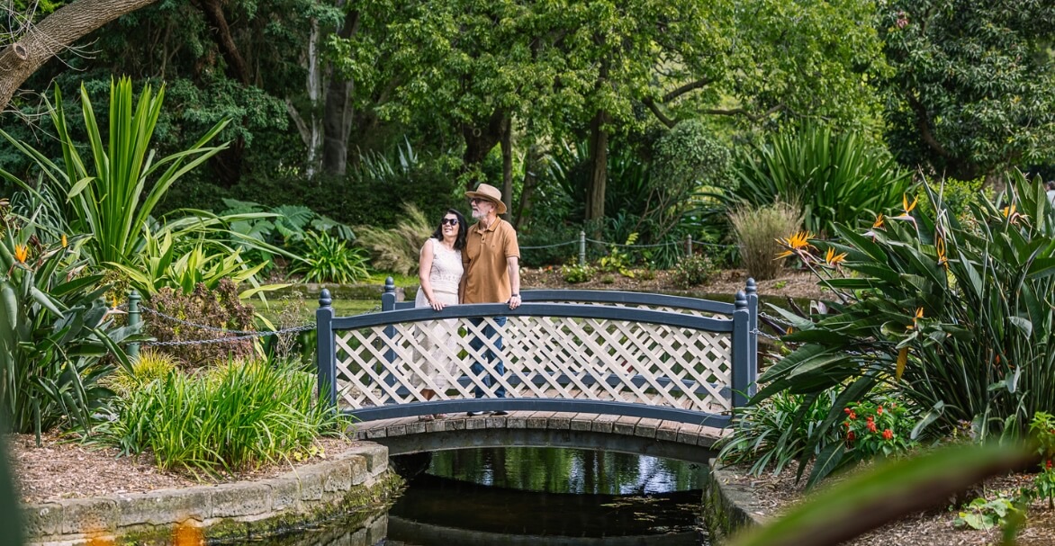 Visitors on a footbridge among lush plantings in the Royal Botanic Garden Sydney