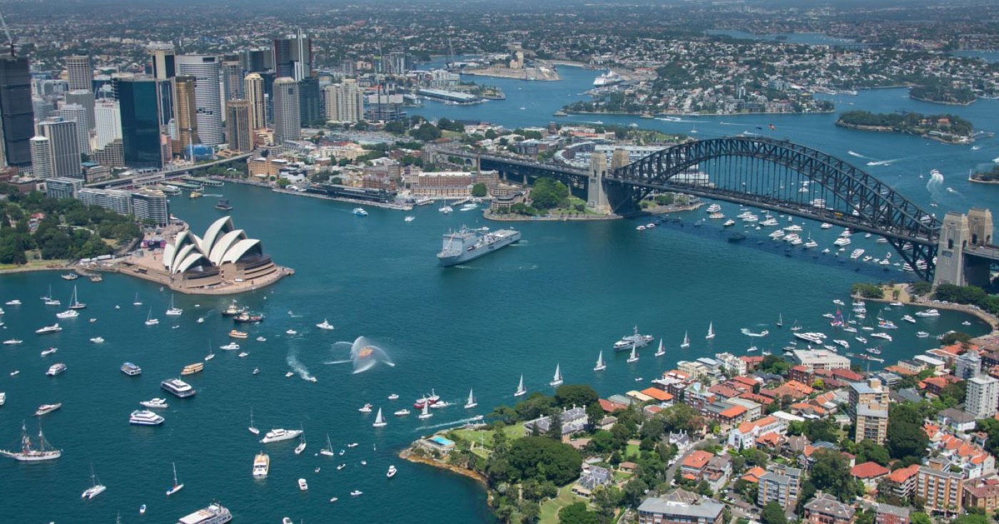 Aerial view of Sydney Harbour full of boats around the Opera House and Harbour Bridge