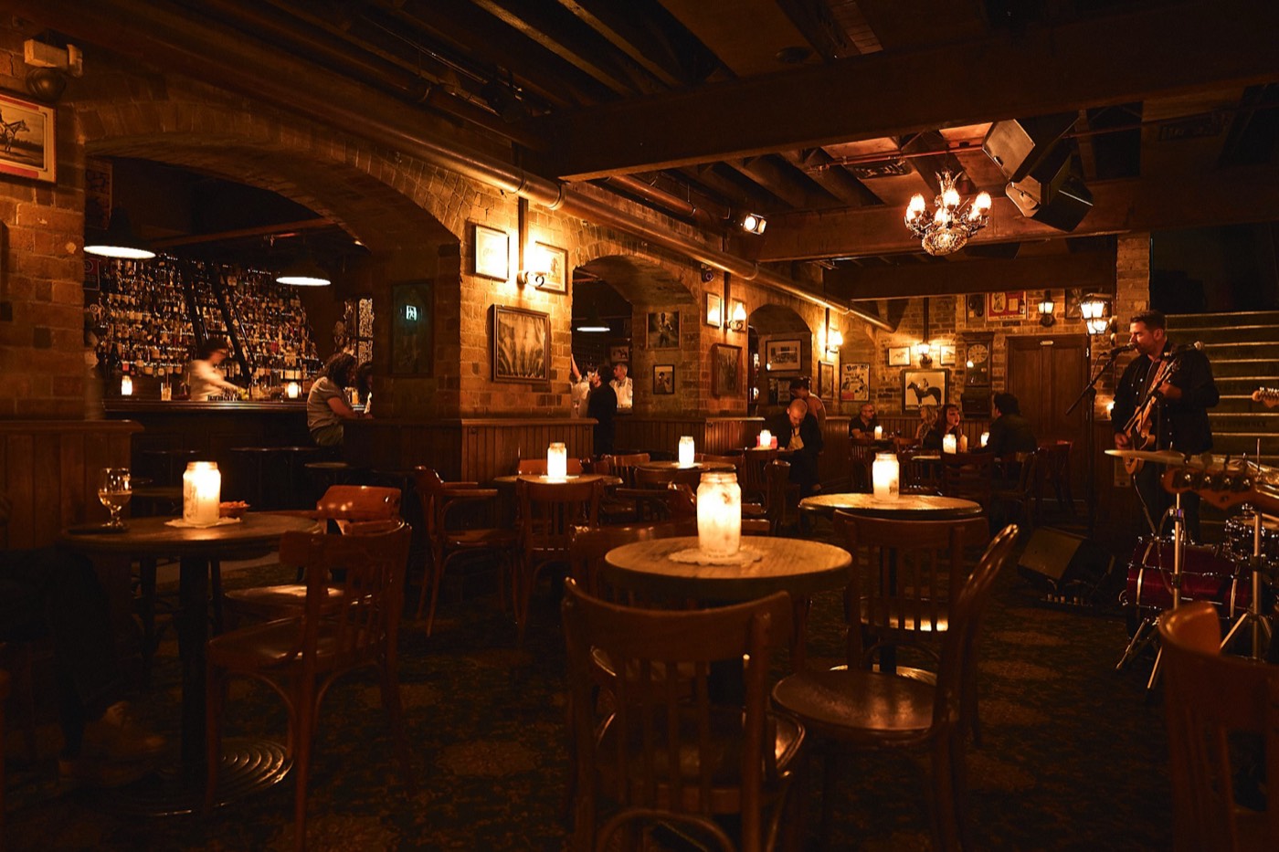 Candlelit tables in The Baxter Inn's basement bar