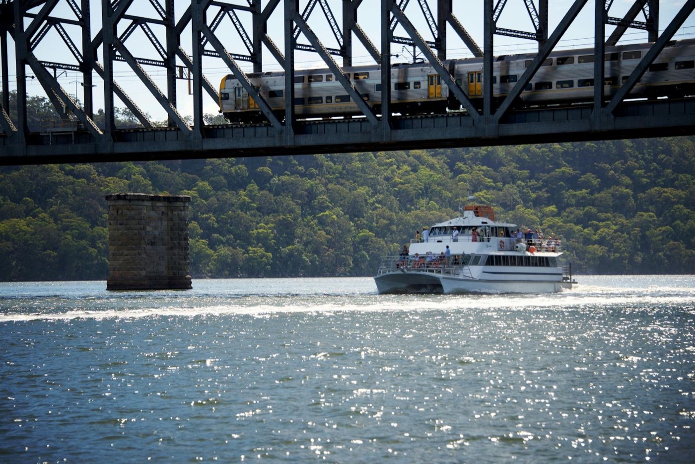 The Riverboat Postman cruising beneath the Hawkesbury River railway bridge at Brooklyn