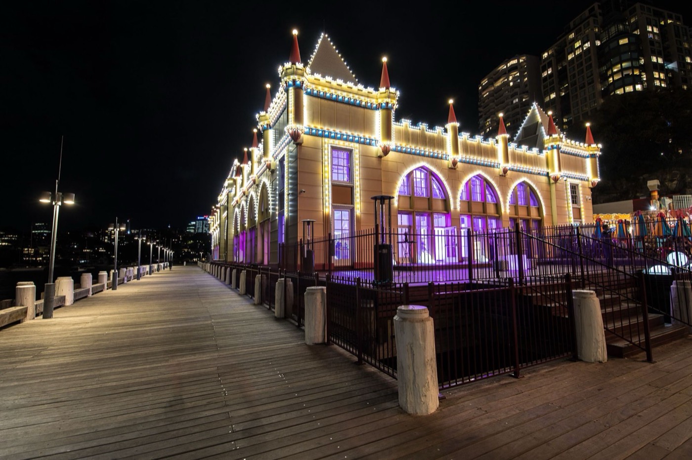 Heritage-listed Crystal Palace function venue at Luna Park lit up at night